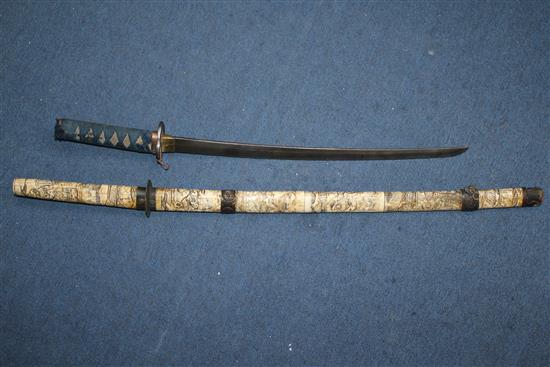 An early 20th century Japanese bone wakizashi and another